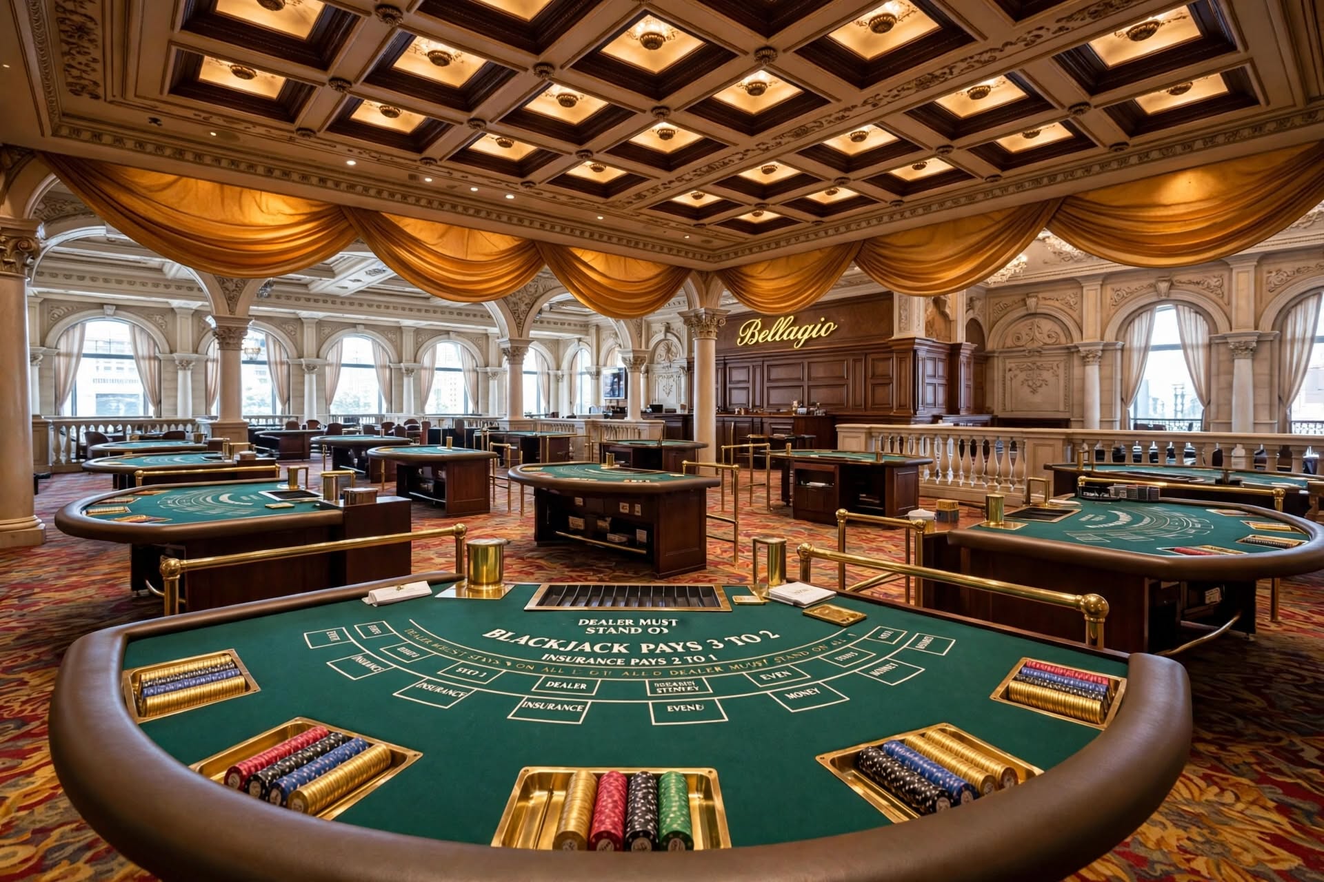 Active baccarat and roulette table pits on the Bellagio casino floor